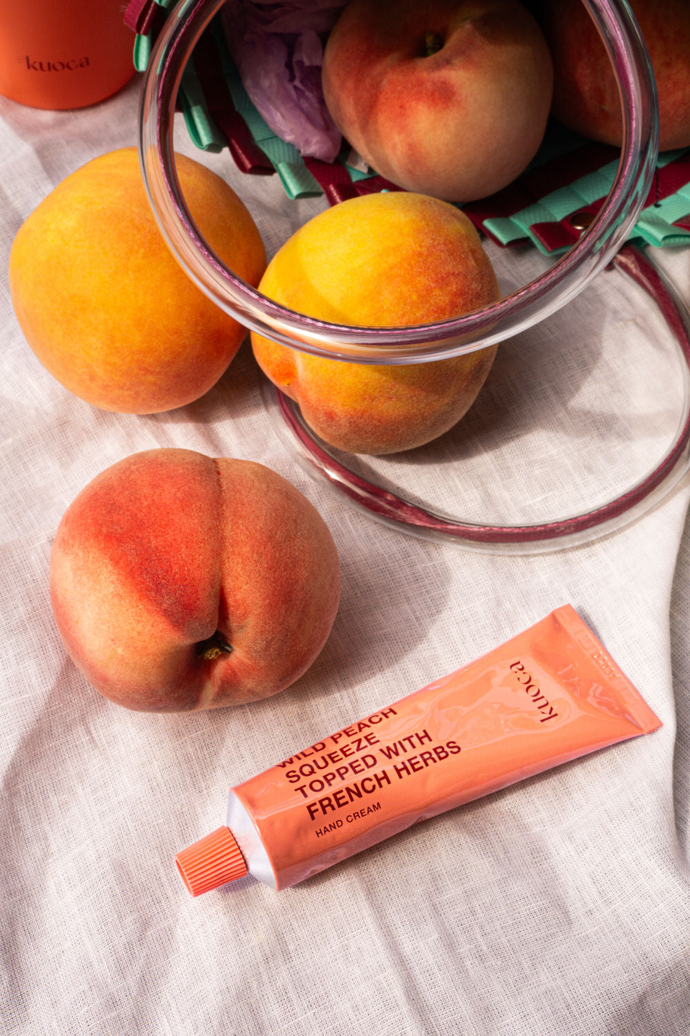 KUOCA Wild Peach Squeeze Topped with French Harbs Hand Cream