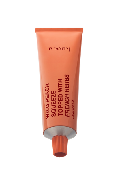 KUOCA Wild Peach Squeeze Topped with French Harbs Hand Cream